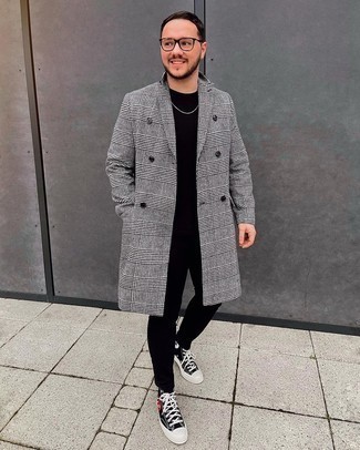 Black Chinos Chill Weather Outfits: A white and black houndstooth overcoat and black chinos are among the crucial elements of any versatile closet. And if you wish to effortlessly tone down your ensemble with footwear, why not rock a pair of black print canvas high top sneakers?