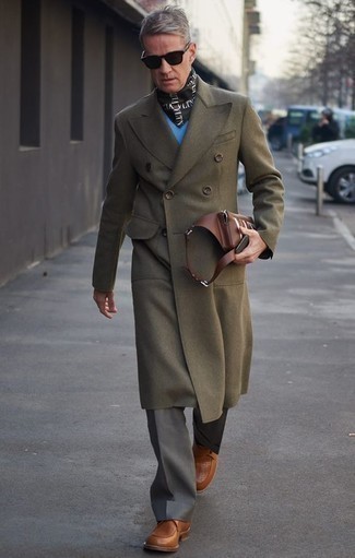 Olive Overcoat Outfits: You're looking at the undeniable proof that an olive overcoat and grey dress pants look awesome when you pair them up in a classy ensemble for today's gentleman. Dial down your look by wearing a pair of brown leather monks.