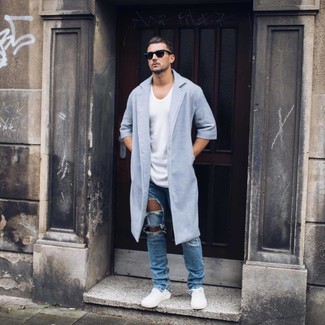 Blue Ripped Jeans Outfits For Men: Solid proof that a light blue overcoat and blue ripped jeans look amazing when married together in a casual look. A pair of white low top sneakers will pull the whole thing together.