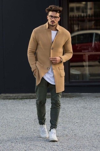 Dark Green Jeans Outfits For Men: If you're in search of a casual yet dapper outfit, go for a camel overcoat and dark green jeans. If you want to immediately dial down this ensemble with a pair of shoes, throw white leather low top sneakers in the mix.