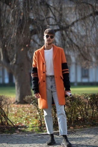 Orange Coat Outfits For Men: An orange coat and light blue jeans are the kind of casually classy items that you can wear a myriad of ways. Ramp up the classiness of this ensemble a bit by rounding off with black athletic shoes.