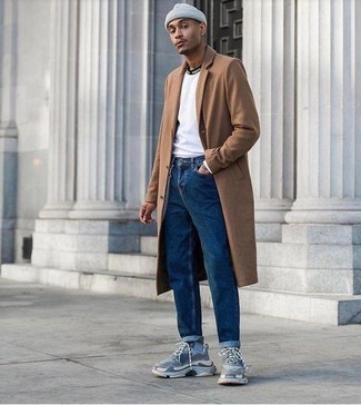 Light Blue Athletic Shoes Outfits For Men: This pairing of a camel overcoat and blue jeans is the perfect base for a casually smart outfit. For a more laid-back touch, complement this look with light blue athletic shoes.