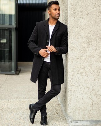 Black Jeans Outfits For Men: For a look that's very simple but can be styled in plenty of different ways, dress in a black overcoat and black jeans. A pair of black leather chelsea boots effortlessly smartens up the outfit.