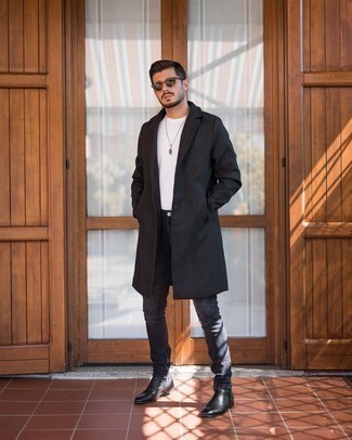 Charcoal Skinny Jeans Outfits For Men: This combo of a black overcoat and charcoal skinny jeans is very easy to do and so comfortable to rock a version of over the course of the day as well! Go off the beaten track and change up your ensemble by rocking a pair of black leather chelsea boots.