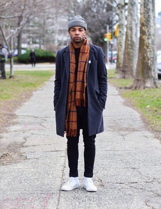 Orange Check Scarf Outfits For Men: You'll be surprised at how extremely easy it is for any man to get dressed like this. Just a navy overcoat matched with an orange check scarf. For maximum style points, complement this ensemble with white leather low top sneakers.