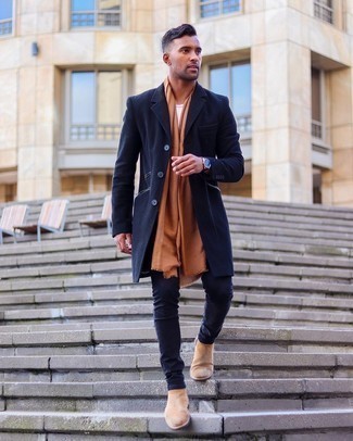 Tan Suede Chelsea Boots Outfits For Men: Extra dapper and practical, this casual pairing of a navy overcoat and navy skinny jeans will provide you with variety. Complement your outfit with a pair of tan suede chelsea boots to completely switch up the outfit.