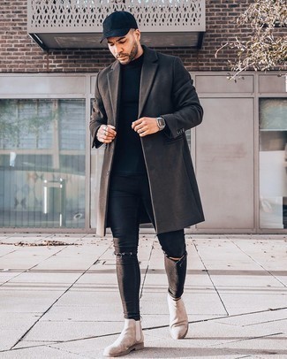 Beige Suede Chelsea Boots Outfits For Men: The versatility of a dark brown overcoat and black ripped skinny jeans means you'll have them on constant rotation in your wardrobe. Beige suede chelsea boots are an effective way to transform this ensemble.