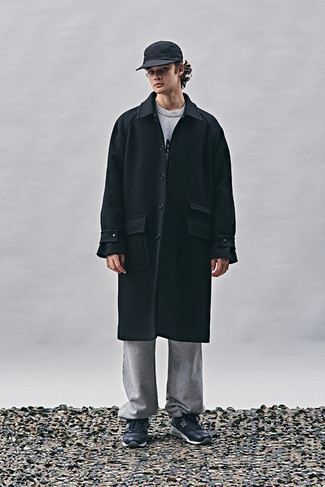 Men's Outfits 2022: This casual combination of a black overcoat and grey sweatpants is ideal when you need to look casually cool in a flash. Wondering how to finish off? Add a pair of black and white athletic shoes to this look for a more casual touch.
