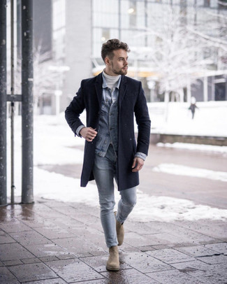 Beige Suede Chelsea Boots Outfits For Men: This pairing of a navy overcoat and light blue jeans looks amazing, but it's extremely easy to pull together. Let your sartorial prowess truly shine by finishing off your ensemble with a pair of beige suede chelsea boots.