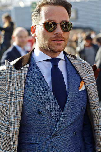 A brown houndstooth overcoat and a blue double breasted blazer? Make no mistake, this outfit will turn every head around.