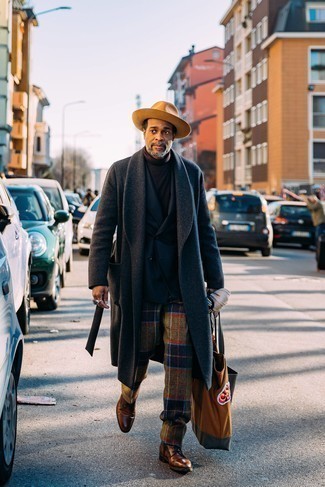 Hat Outfits For Men: A charcoal overcoat and a hat are an off-duty combination that every modern guy should have in his off-duty sartorial collection. Wondering how to complete your outfit? Rock brown leather casual boots to bump it up a notch.