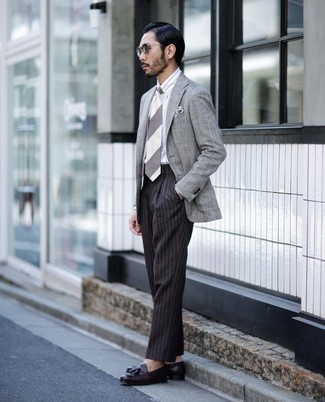 White Vertical Striped Dress Shirt Outfits For Men: For a look that's elegant and wow-worthy, rock a white vertical striped dress shirt with black vertical striped dress pants. Dark brown leather tassel loafers tie the outfit together.
