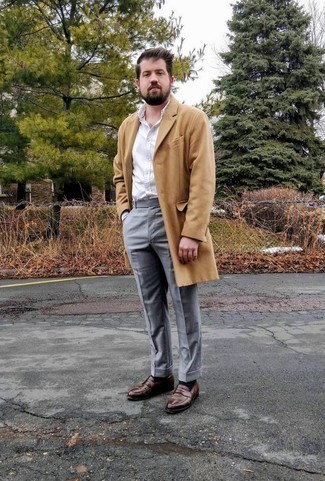 Brown Leather Loafers Outfits For Men: Irrefutable proof that a camel overcoat and grey dress pants look amazing if you wear them together in a classy outfit for a modern dandy. For shoes, you can follow a more casual route with brown leather loafers.