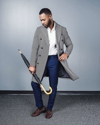 Grey Vertical Striped Overcoat Outfits: This elegant pairing of a grey vertical striped overcoat and navy dress pants is a favored choice among the sartorially superior chaps. Grab a pair of brown suede tassel loafers and the whole look will come together wonderfully.