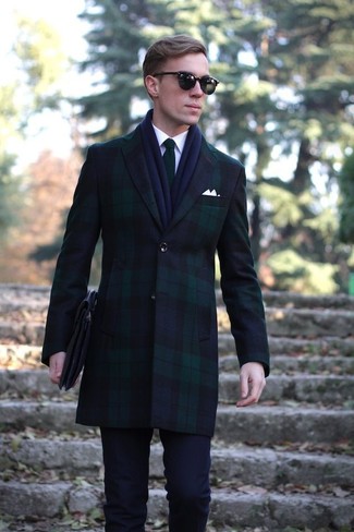 Reach for a navy and green overcoat and navy dress pants for a truly stylish outfit.
