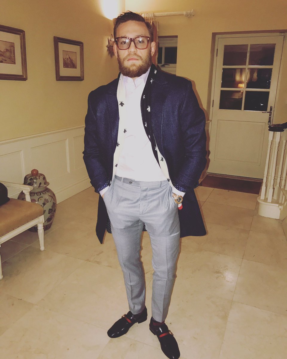 Conor McGregor wearing Navy Overcoat, White Dress Shirt, Grey Check Dress  Pants, Black Leather Loafers | Lookastic