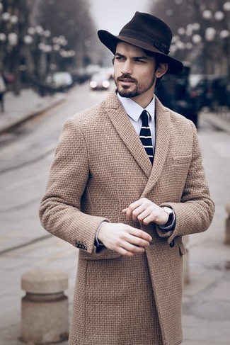 Navy and White Tie Outfits For Men: Combining a camel overcoat and a navy and white tie is a fail-safe way to breathe rugged refinement into your wardrobe.
