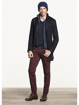 Burgundy Jeans Outfits For Men: Try pairing a black overcoat with burgundy jeans to put together an interesting and put together ensemble. If you want to easily smarten up this outfit with footwear, go for a pair of brown leather brogues.