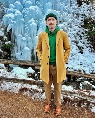Dark Green Beanie Outfits For Men: A yellow overcoat and a dark green beanie are worth being on your list of indispensable casual styles. Channel your inner Ryan Gosling and introduce brown leather oxford shoes to the equation.