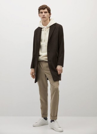 500+ Chill Weather Outfits For Men: This look with a dark brown houndstooth overcoat and khaki chinos isn't so hard to pull together and easy to change. Up your whole ensemble by slipping into white canvas low top sneakers.