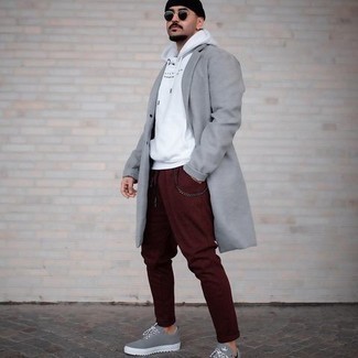 White Print Hoodie Outfits For Men: Uber stylish and functional, this casual combo of a white print hoodie and burgundy chinos will provide you with variety. This getup is finished off really well with grey canvas low top sneakers.