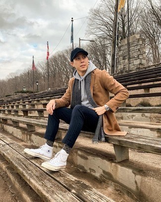 White Canvas High Top Sneakers Outfits For Men: Breathe a sense of casual refinement into your daily routine with a camel overcoat and navy vertical striped chinos. Go ahead and complement this outfit with white canvas high top sneakers for a more laid-back twist.