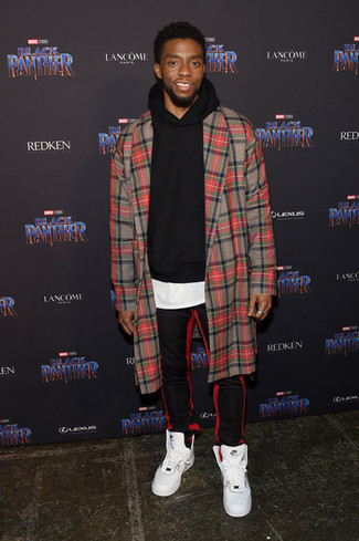 When the setting allows relaxed casual style, try teaming a red plaid overcoat with red and black vertical striped sweatpants. A pair of white leather high top sneakers effortlesslly ramps up the cool of this outfit.