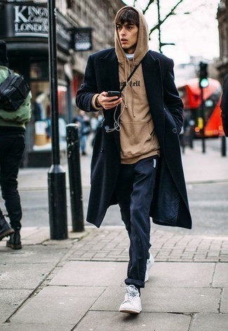 Beige Hoodie Outfits For Men: Such items as a beige hoodie and navy jeans are the perfect way to introduce subtle dapperness into your daily routine. Let your sartorial sensibilities truly shine by finishing off your outfit with white leather low top sneakers.