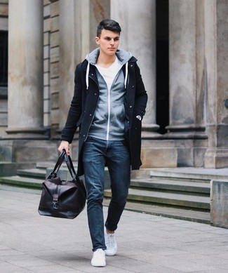 Brown Leather Duffle Bag Outfits For Men: A black overcoat and a brown leather duffle bag are a modern casual pairing that every fashion-forward guy should have in his casual wardrobe. If in doubt as to what to wear when it comes to shoes, go with a pair of white canvas low top sneakers.