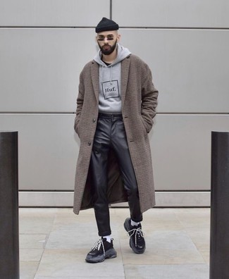 Brown Check Overcoat Outfits: This is undeniable proof that a brown check overcoat and black leather jeans are amazing when worn together. Inject a more casual feel into this look by rocking a pair of black athletic shoes.
