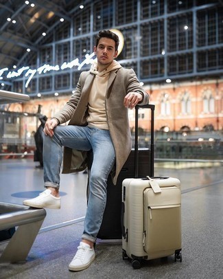 Tan Suitcase Outfits For Men: Marry a camel overcoat with a tan suitcase for an off-duty outfit with an urban finish. White canvas low top sneakers are the ideal complement for this look.