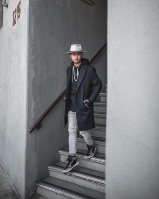 Grey Jeans Outfits For Men: A black overcoat and grey jeans are a nice combo to add to your current casual lineup. Introduce black print leather high top sneakers to the mix to make a classic look feel suddenly fresh.