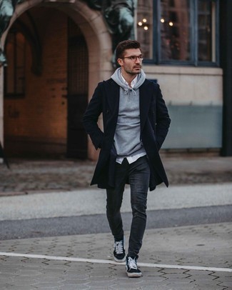 Charcoal Skinny Jeans Outfits For Men: This casual combo of a navy overcoat and charcoal skinny jeans is a solid bet when you need to look sharp in a flash. To give your overall look a more relaxed spin, introduce black print canvas low top sneakers to the mix.