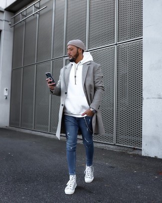 Blue Ripped Skinny Jeans Outfits For Men: This laid-back combo of a grey overcoat and blue ripped skinny jeans can only be described as incredibly stylish. Give a relaxed twist to your ensemble by finishing with a pair of grey print canvas high top sneakers.