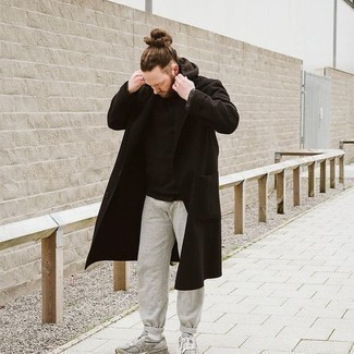 1200+ Cold Weather Outfits For Men: Consider wearing a black overcoat and grey sweatpants for both dapper and easy-to-achieve outfit. For something more on the daring side to finish off your outfit, add a pair of grey athletic shoes to the mix.