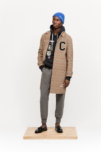Sweatpants Outfits For Men: If you're seeking to take your off-duty fashion game to a new level, marry a camel plaid overcoat with sweatpants. You know how to play it up: black leather tassel loafers.