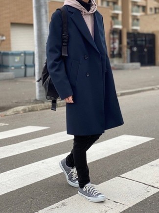 Grey Canvas Low Top Sneakers Outfits For Men: This combination of a navy overcoat and black chinos is certainly jaw-dropping, but it's very easy to assemble. A pair of grey canvas low top sneakers will instantly tone down an all-too-refined outfit.