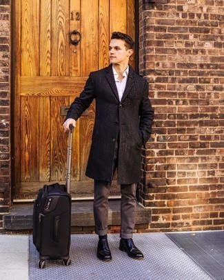 Black Suitcase Outfits For Men: A black overcoat and a black suitcase married together are a sartorial dream for those dressers who love casually cool styles. A trendy pair of black leather oxford shoes is the simplest way to inject a touch of class into this ensemble.