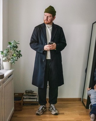 Black Overcoat Outfits: Combining a black overcoat and dark green chinos is a fail-safe way to infuse your styling repertoire with some effortless refinement. A pair of olive athletic shoes easily steps up the street cred of this ensemble.