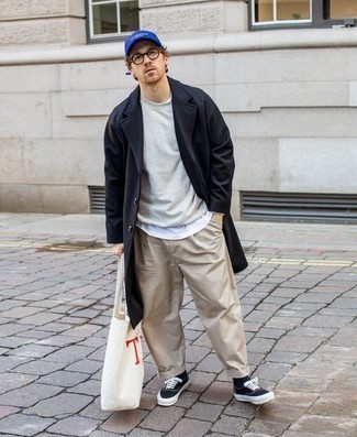 Beige Chinos Casual Outfits: A navy overcoat and beige chinos are essential in any guy's functional wardrobe. Throw black and white canvas low top sneakers in the mix to have some fun with things.