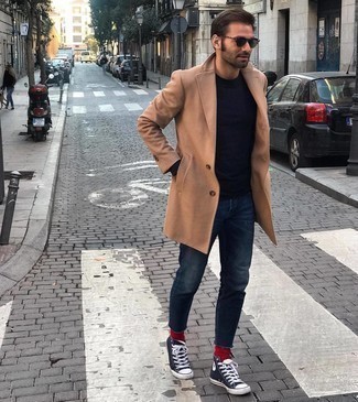 Camel Overcoat Casual Outfits: Amp up your styling game in a camel overcoat and navy jeans. Navy and white canvas high top sneakers will add a laid-back feel to an otherwise traditional look.