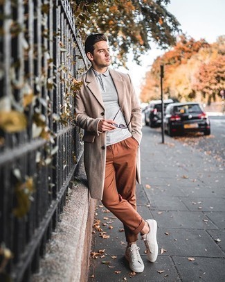 Beige Suede Low Top Sneakers Outfits For Men: Channel your inner visionary in the men's style department and opt for a beige overcoat and tobacco chinos. For something more on the casually edgy side to complete this look, introduce beige suede low top sneakers to the mix.