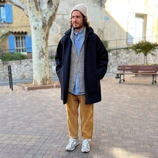 Navy Overcoat Outfits: A navy overcoat and tobacco corduroy chinos are the perfect way to infuse some manly refinement into your day-to-day arsenal. If you want to immediately play down your ensemble with one single piece, complement this outfit with a pair of grey athletic shoes.