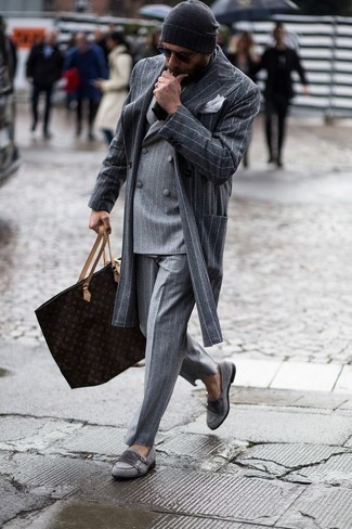 Dark Brown Print Leather Tote Bag Outfits For Men: A grey vertical striped overcoat and a dark brown print leather tote bag are great menswear must-haves that will integrate wonderfully within your off-duty collection. Level up this look with a pair of grey suede double monks.