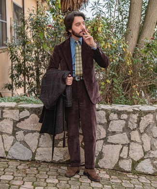Dark Brown Plaid Overcoat Outfits: Wear a dark brown plaid overcoat and a dark brown suit for rugged refinement with a modernized spin. Let your styling credentials really shine by completing your outfit with a pair of dark brown suede desert boots.