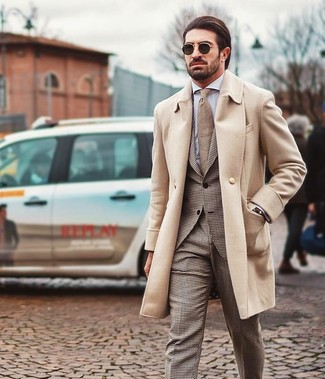 Brown Suit Outfits: Team a brown suit with a beige overcoat to be the embodiment of sophistication.