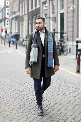 Olive Overcoat Outfits: This pairing of an olive overcoat and a navy suit resonates polish and class. Get a bit experimental with shoes and tone down your look by rounding off with a pair of dark green leather derby shoes.