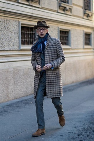 Charcoal Houndstooth Overcoat Outfits: You're looking at the undeniable proof that a charcoal houndstooth overcoat and a grey suit are awesome when teamed together in a refined outfit for a modern dandy. Brown suede desert boots will add a laid-back feel to this getup.