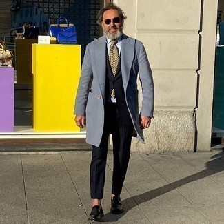 Yellow Tie Outfits For Men: Consider wearing a light blue overcoat and a yellow tie to look like a perfect gent. A trendy pair of black leather loafers is a simple way to bring a dose of stylish effortlessness to this outfit.