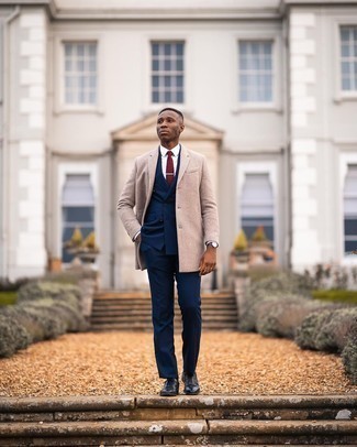 Navy Suit Outfits: Pairing a navy suit with a beige overcoat is an amazing idea for a classic and polished look. Navy leather oxford shoes integrate really well within a multitude of combos.